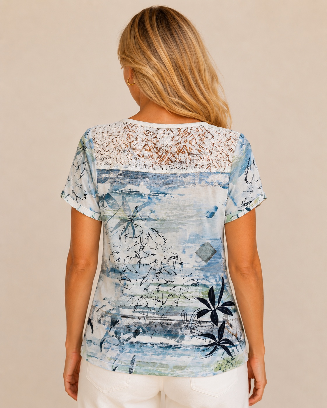 A329F9D8-7873-4FB0-98AB-B70915764511 Kalisson blue floral lace top with abstract botanical print, short sleeves and lightweight cotton blend fabric.