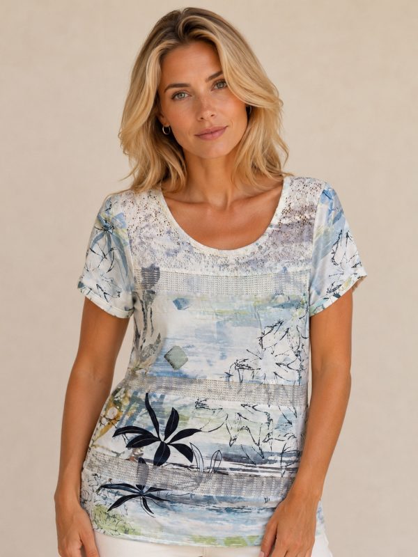 Kalisson blue floral lace top with abstract botanical print, short sleeves and lightweight cotton blend fabric.