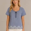 Kav2639-01-front Kalisson blue cotton top with embroidered hem and decorative neckline detail