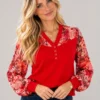 01red-floral-sleeve-v-neck-top.webp Kalisson Red V-neck top with four-button detail and long floral sleeves