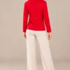 04red-studded-long-sleeve-top.webp Kalisson Women's red cotton long sleeve top with decorative dark stud detailing