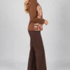 brown-abstract-print-zip-jacket-side Brown abstract print zip jacket with stand collar and long sleeves, upper-body front view.