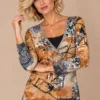 ka-20i003-abstract-print-wrap-top-upper-body Kalisson abstract print wrap top in rust, beige, grey and black, upper-body view.